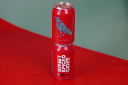 Two Cans of Mr Bridges red 'Sweet Spiced Cider' cans with raven artwork. 