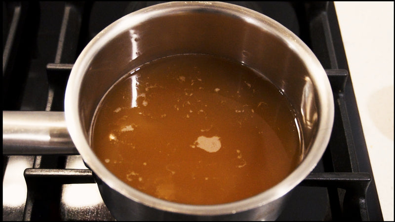 Mr Bridges sweet spiced cider simmering on a stove and ready to pour